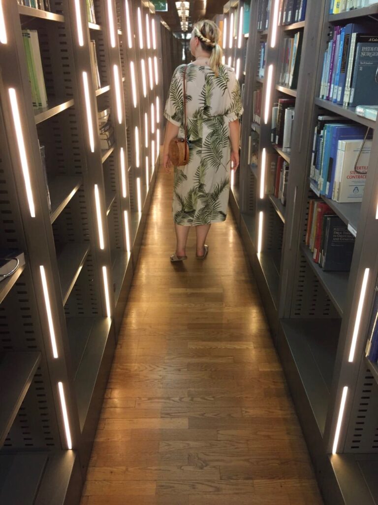 woman walking in bibliotheca in Alexandria Egypt