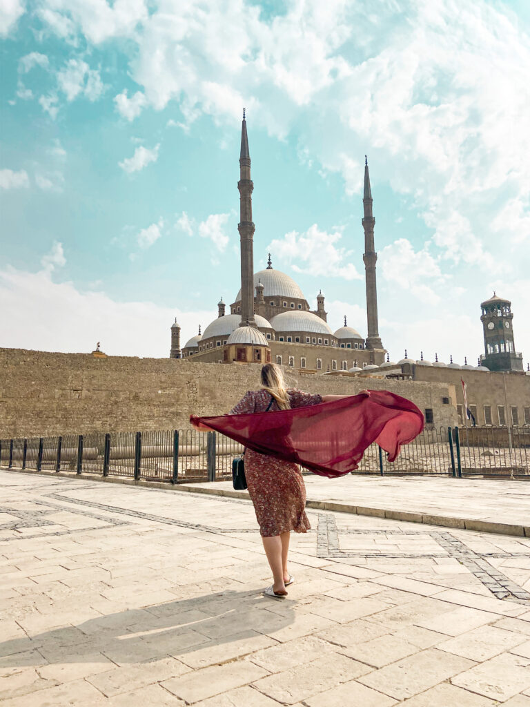 woman in front of mosque cairo egypt