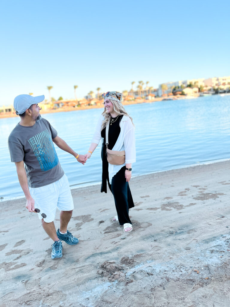 Couple holding hands on the beach El Gouna Egypt