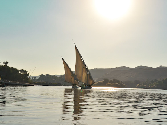 two felukka traditional egyptian boats on the nile river aswan egypt